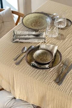 Elegant Rustic Table Setting with Ceramic Plates and Wine Glasses Stock Photos