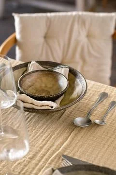 Elegant Rustic Table Setting with Ceramic Plates and Wine Glasses Stock Photos
