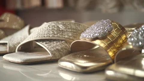 Elegant sandals with decorative elements showcased on display Stock Footage 308434270