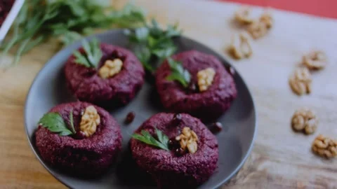 Elegant serving detail: capturing walnut and beet texture Stock Footage 342200474