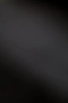 Elegant Slate Gray Gradient Backdrop with Subtle Light Play, Seamless for D.. Stock Photos