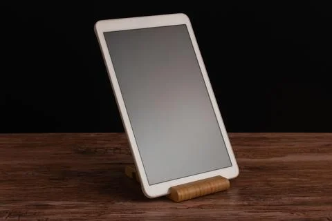 Elegant smart home control panel on a wooden base combining advanced technolo Stock Photos