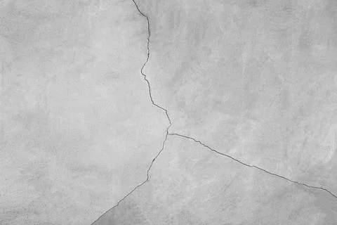 Elegant split crack in gray stone texture background Stock Photos