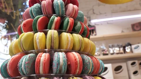 Elegant stack of colorful macarons at a Parisian bakery in springtime Stock Footage 288737466