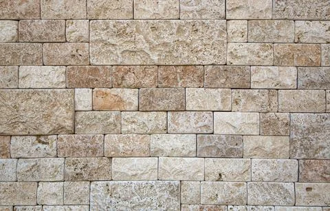 Elegant stone wall from small rectangular parts Part of the wall of natura... Stock Photos