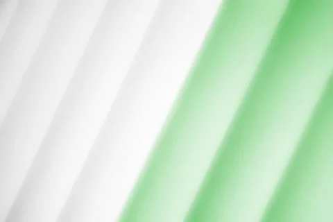 Elegant striped green background pattern fading into white space Stock Photos