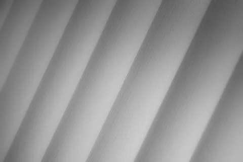 Elegant striped grey background pattern fading into white space Foto stock
