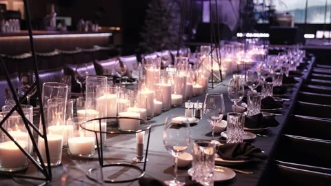 Elegant table set with glasses, lighted candles Stock Footage 167098158