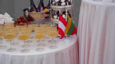 Elegant Table Setting with Austrian and Lithuanian Flags Stockbeeldmateriaal 325366703