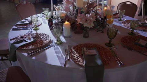 Elegant Table Setting with Candles and Floral Centerpiece Stockbeeldmateriaal 331179873