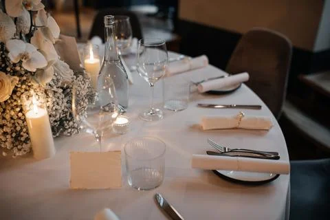Elegant Table Setting with Candles and Flowers Stock Photos
