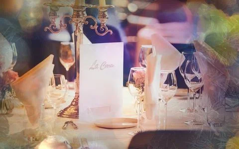 Elegant Table Setting with Candles and Menu Ready for Celebration Dinner Stock Photos