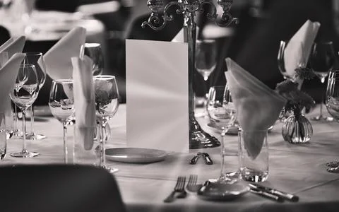 Elegant Table Setting with Candlestick and Blank Menu Card for Fine Dining .. Stock Photos