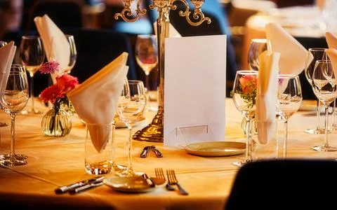 Elegant Table Setting With Candlestick And Flowers For A Formal Dinner Event Stock Photos