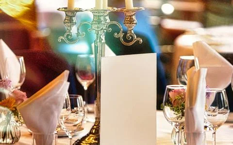 Elegant Table Setting With Candlesticks And Blank Menu For Event Or Celebrati Stock Photos