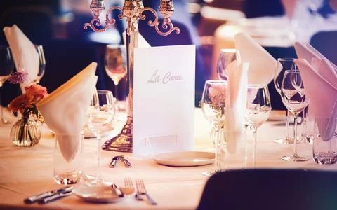 Elegant Table Setting with Candlesticks Napkins and Wine Glasses for Fine D.. Stock Photos