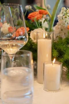 Elegant table setting capturing a cozy, inviting atmosphere with flickering Stock Photos