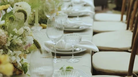 Elegant Table Setting Complete with Stunning Floral Arrangements and Decor Stock Footage 306297575