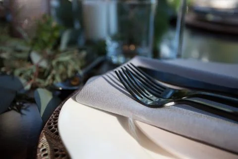 Elegant Table setting for dinner with closeup view of silverware on a plate. Stock Photos