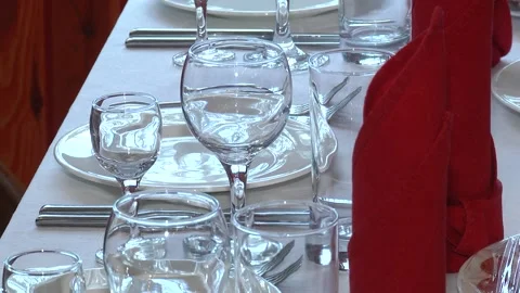 Elegant table setting with fork, knife and red napkin. Stock-Footage 123967852