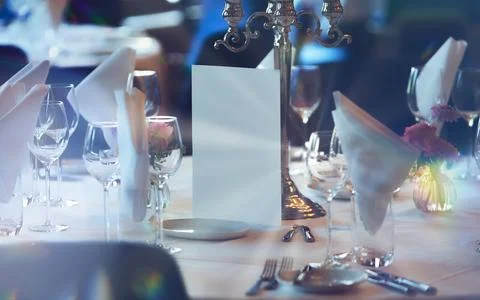Elegant table setting for formal event with candles and glassware at restaura Stock Photos