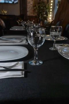 Elegant table setting for a gourmet dinner celebration with fine glassware .. Stock Photos