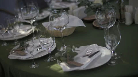 Elegant Table Setting with Green Tablecloth Stock Footage 313227015