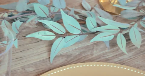 Elegant table setting with greenery and gold accents 스톡 동영상 232441407
