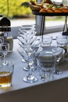 Elegant Table Setting with Martini Glasses and Fruit Platter 写真素材