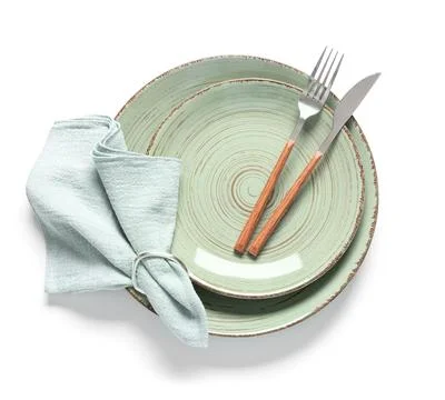 Elegant table setting with mint green ceramic plates, wooden handle cutlery,  Stock Photos