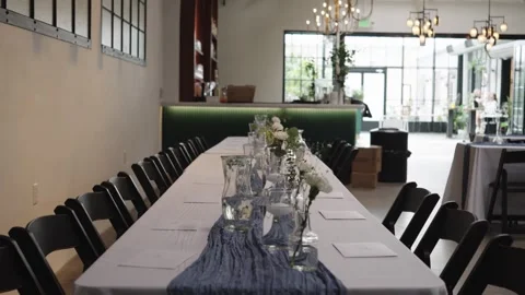 Elegant Table Setting in a Modern, Light-Filled Event Venue Stock Footage 336756749