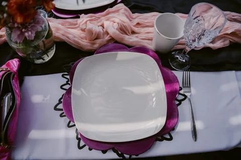 Elegant Table Setting with Pink and Purple Accents Stock Photos