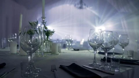 Elegant table setting preparation in soft light Stock Photos