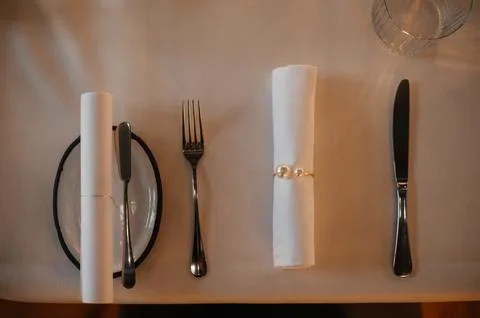 Elegant Table Setting with Rolled Napkin and Cutlery Stock Photos