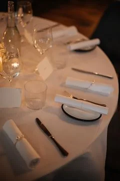 Elegant Table Setting with Rolled Napkins and Glassware Stock Photos