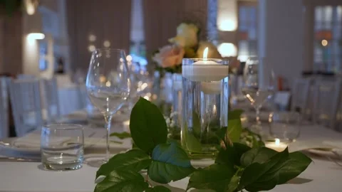 An Elegant Table Setting Showcasing Floating Candles Alongside Beautiful Floral Stock Footage 316513132