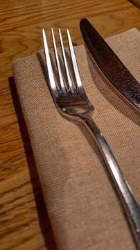 Elegant table setting with silver fork and knife on linen concept. Fotos Stock