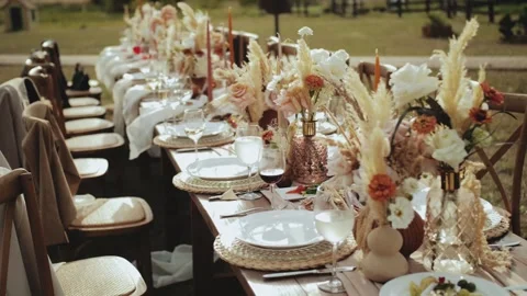Elegant table setting with tableware, flowers, and glasses at a function hall Stock Footage 267844406