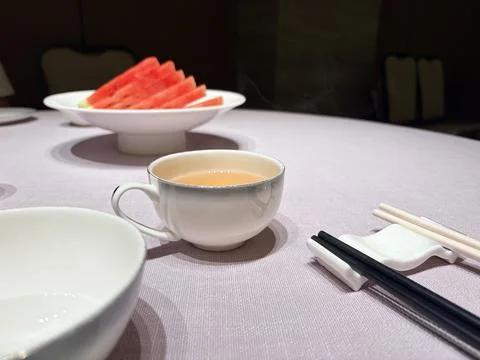 Elegant Table Setting with Tea and Watermelon Slices Stock Photos