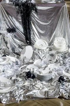 Elegant table setting with white plates and silver decor for special occasion Stock Photos