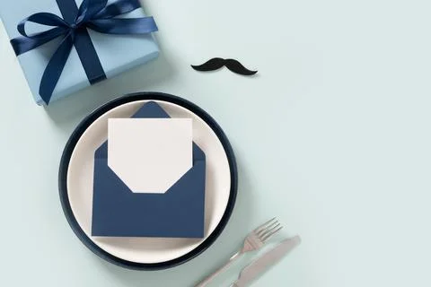 Elegant Table Setup with Invitation and Gift Box Stock Photos
