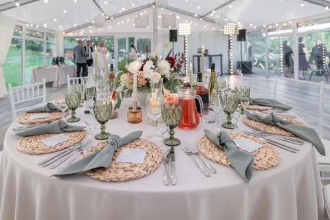 Elegant Table Setup at Wedding Reception with Candles and Floral Centerpiece Stock Photos