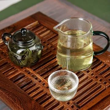 An Elegant Tea Presentation Featuring Exquisite Brews Alongside a Beautiful 写真素材