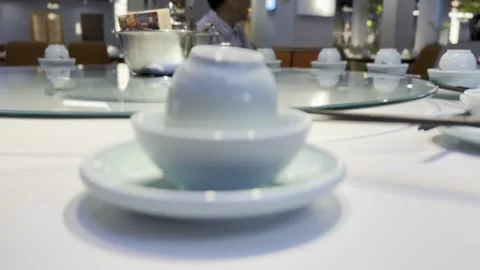 Elegant Tea Set on a Reflective Table Stock Footage 343876455