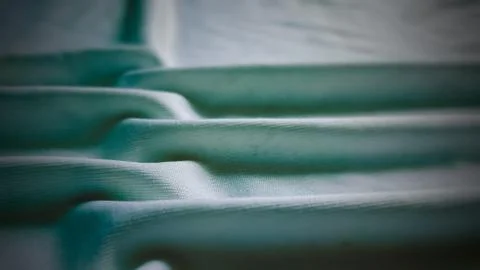 Elegant turquoise coloured soft fabric foldings Stock Photos
