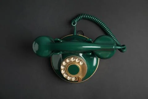 Elegant vintage green telephone on black background, top view Stock Photos