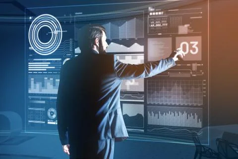 Elegant web developer wearing a suit and working at the program Stock Photos
