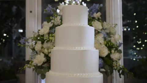 An Elegant Wedding Cake Display Featuring Beautiful Flowers and a Stunning Stock Footage 314576118