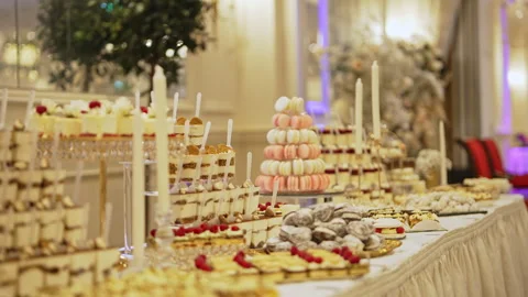 Elegant Wedding Dessert Table with Macaron Tower and Luxury Pastries Stock Footage 327774056