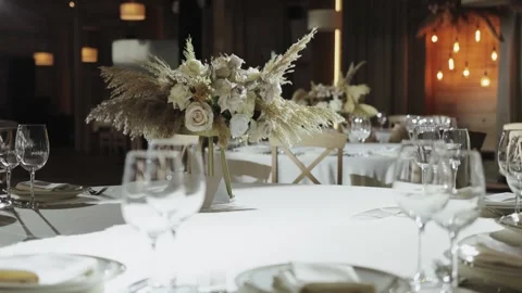 Elegant wedding reception with beautiful table setup and flowers Stock Footage 306361550